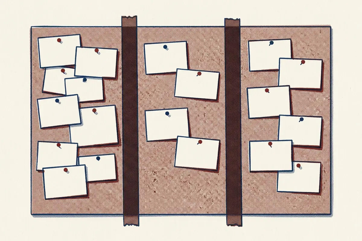 A board divided into three columns holding paper cards, most in the first column and some in the last.