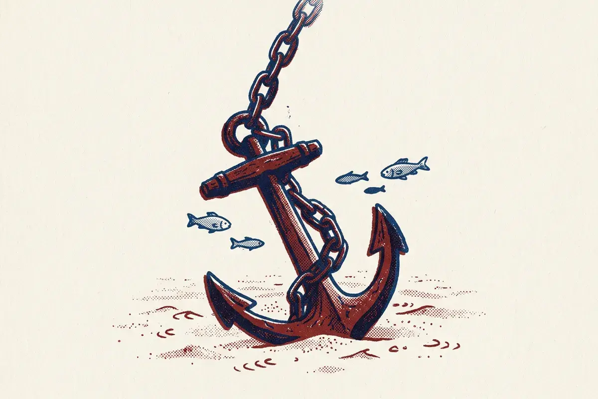 An anchor resting on the sea floor with its chain rising out of view.